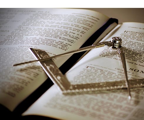 Holy Bible with square and compasses.